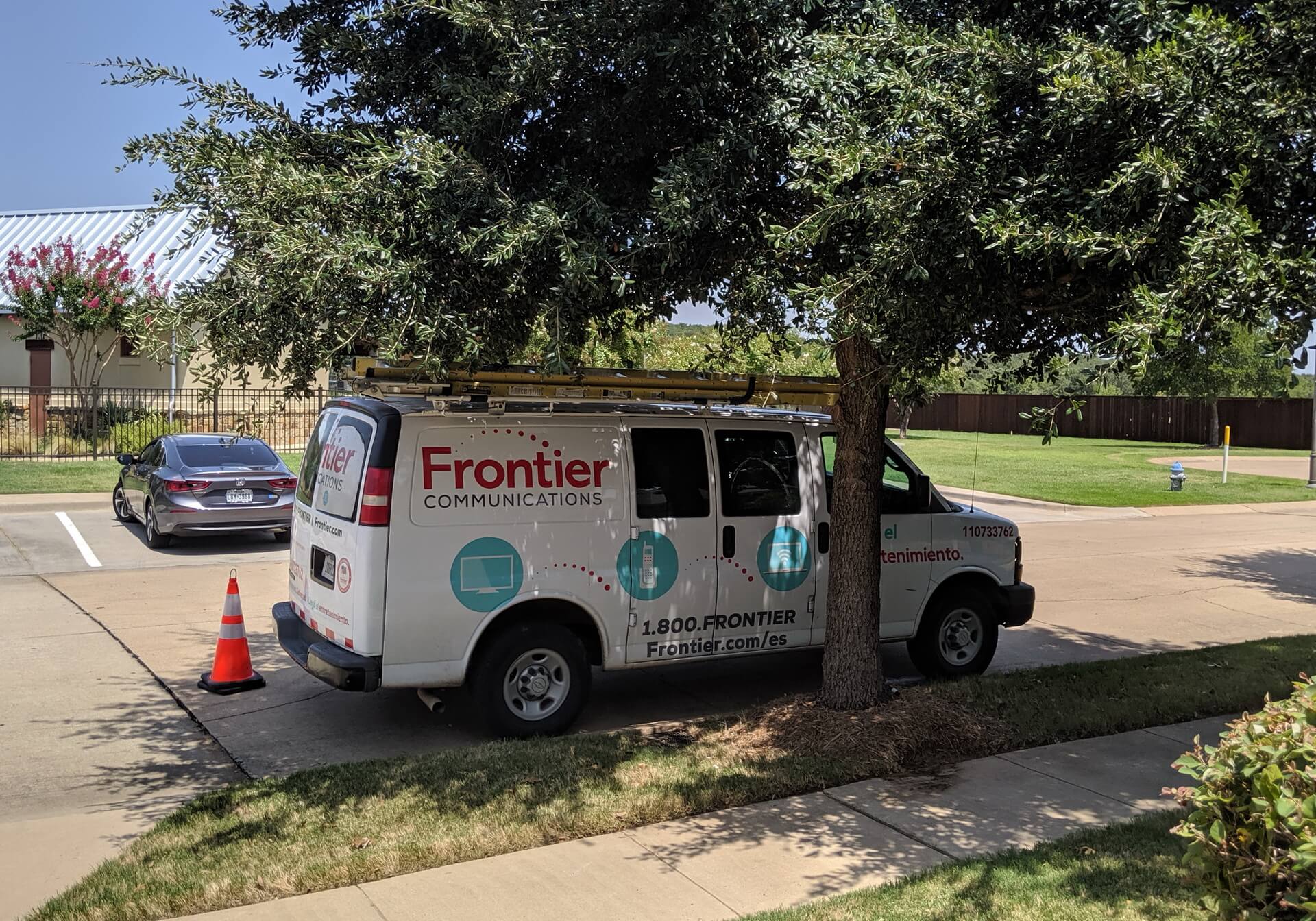 Frontier Communications van parked on the street in front of my house